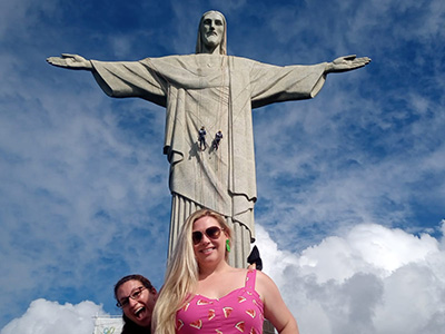 Tourist at the foot of the Christ the Redeemer statue.
